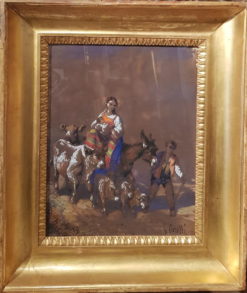 Opera di Consalvo Carelli (1818-1900) intitolata ritorno dai pascoli con cornice coeva. Pittore appartenente alla tradizione ottocentesca italiana, Carelli interpreta il paesaggio rurale con sensibilità romantica e attenzione naturalistica. Le figure umane e gli animali, inseriti in un contesto bucolico, contribuiscono a evocare un'atmosfera serena e armoniosa, in cui la vita quotidiana si fonde con la bellezza della natura. La resa luminosa e i dettagli pittorici rivelano labilità tecnica e la finezza descrittiva dell'artista.
